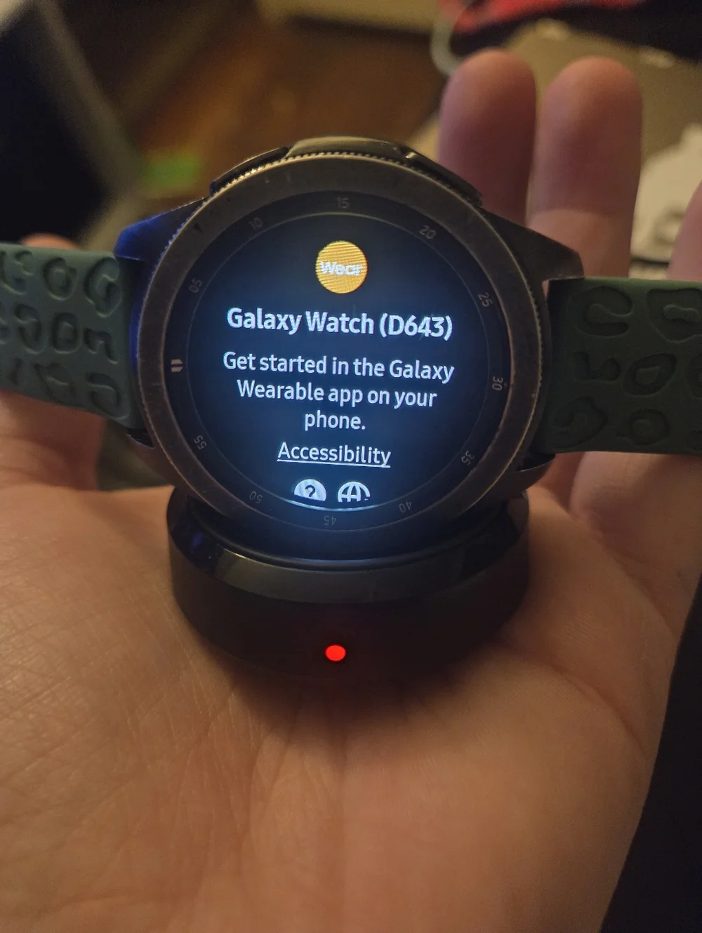 Samsung Galaxy Smartwatch with Teal Band and Charging Dock